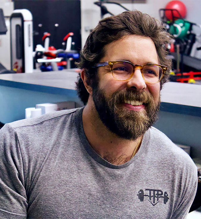 TTP Fitness employee smiling .