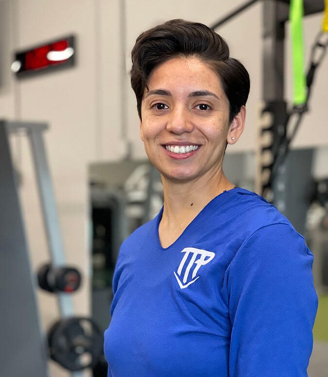 TTP Fitness employee smiling.