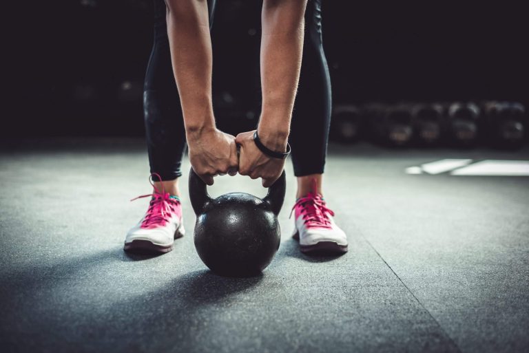 Person lifting a kettle bell