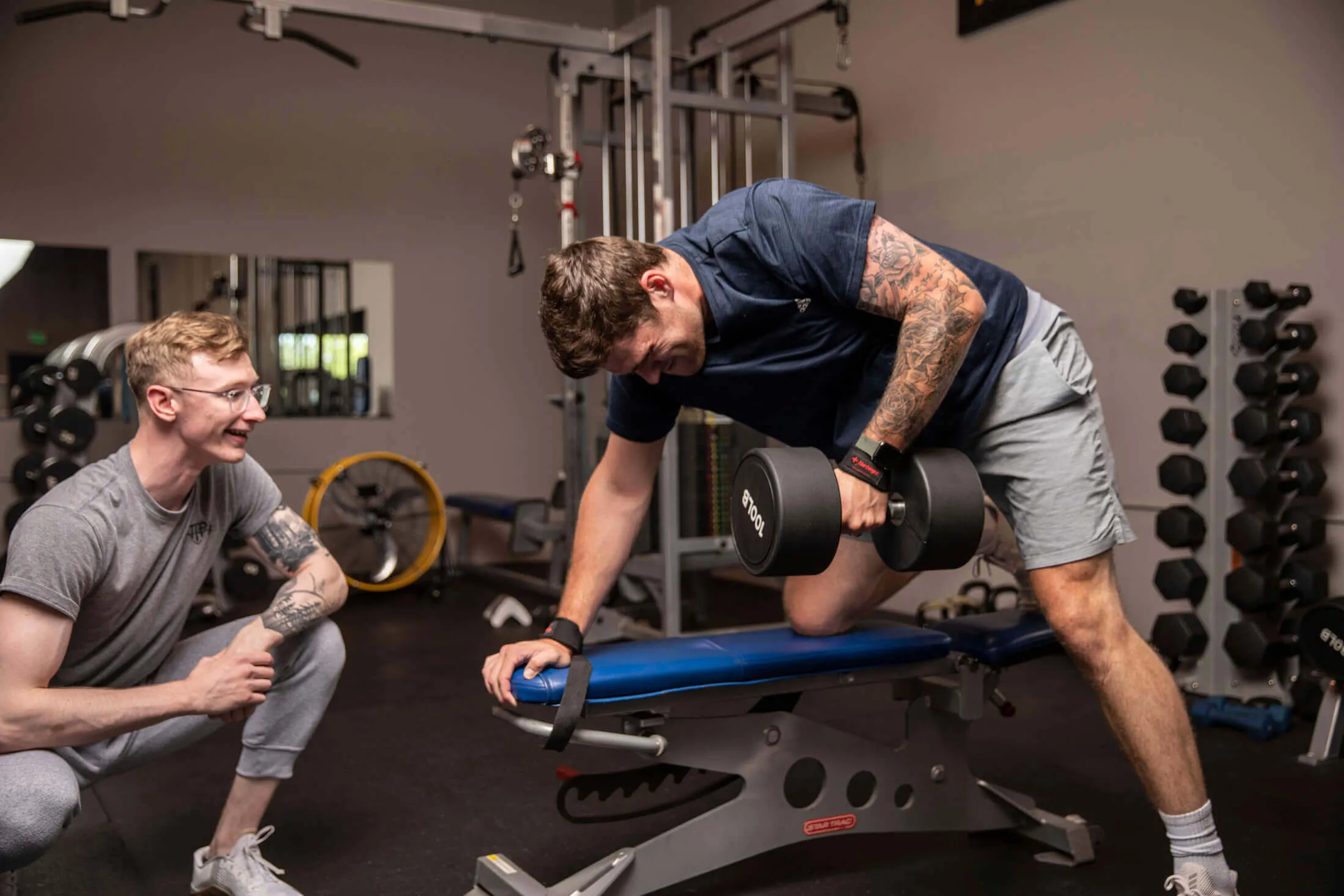 Person lifting weights during strength training session