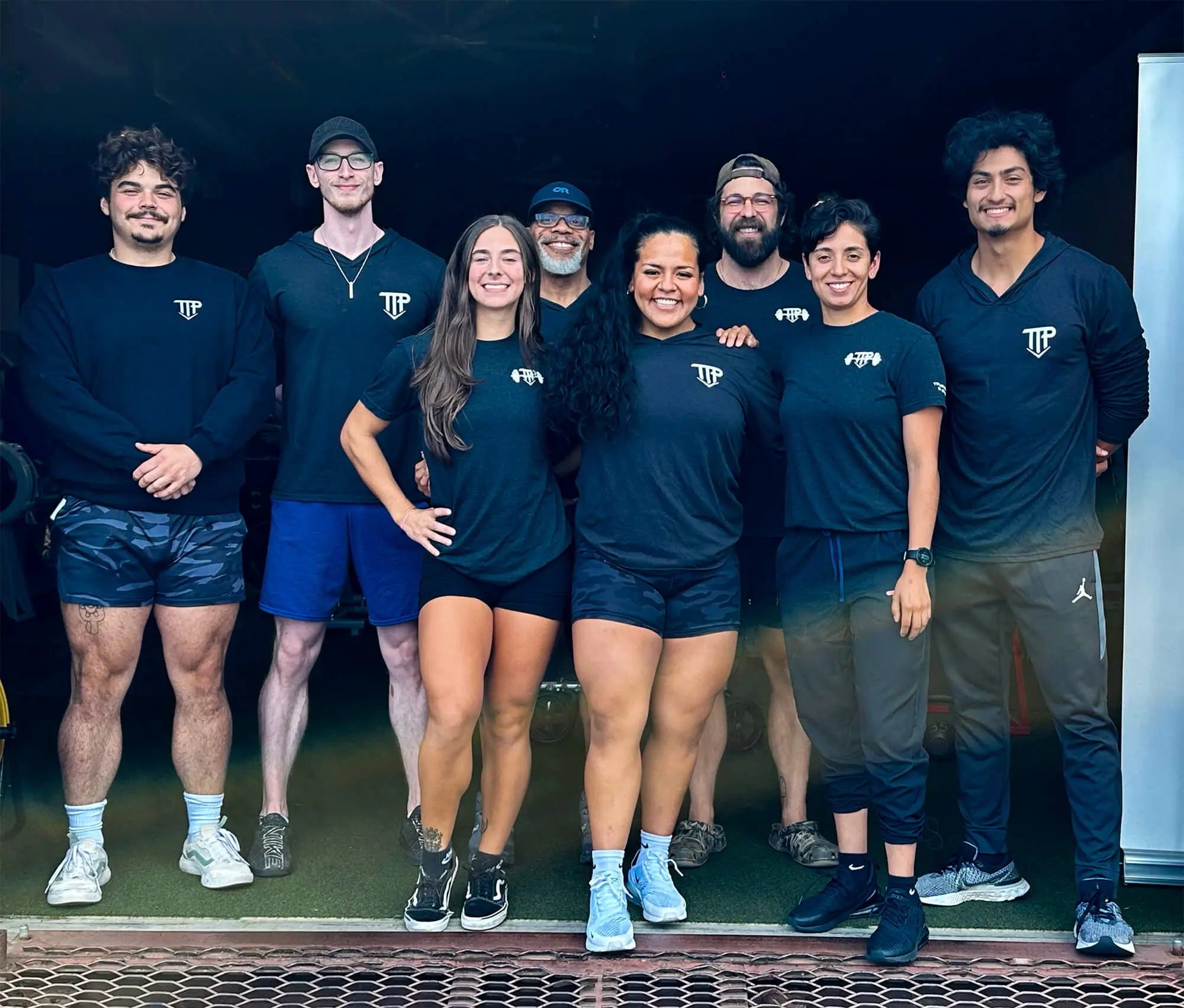 TTP Fitness personal trainers posing as a team at the gym
