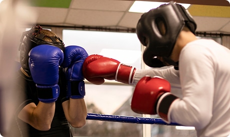 Participants training in a high-energy boxing workout class during boxing classes.