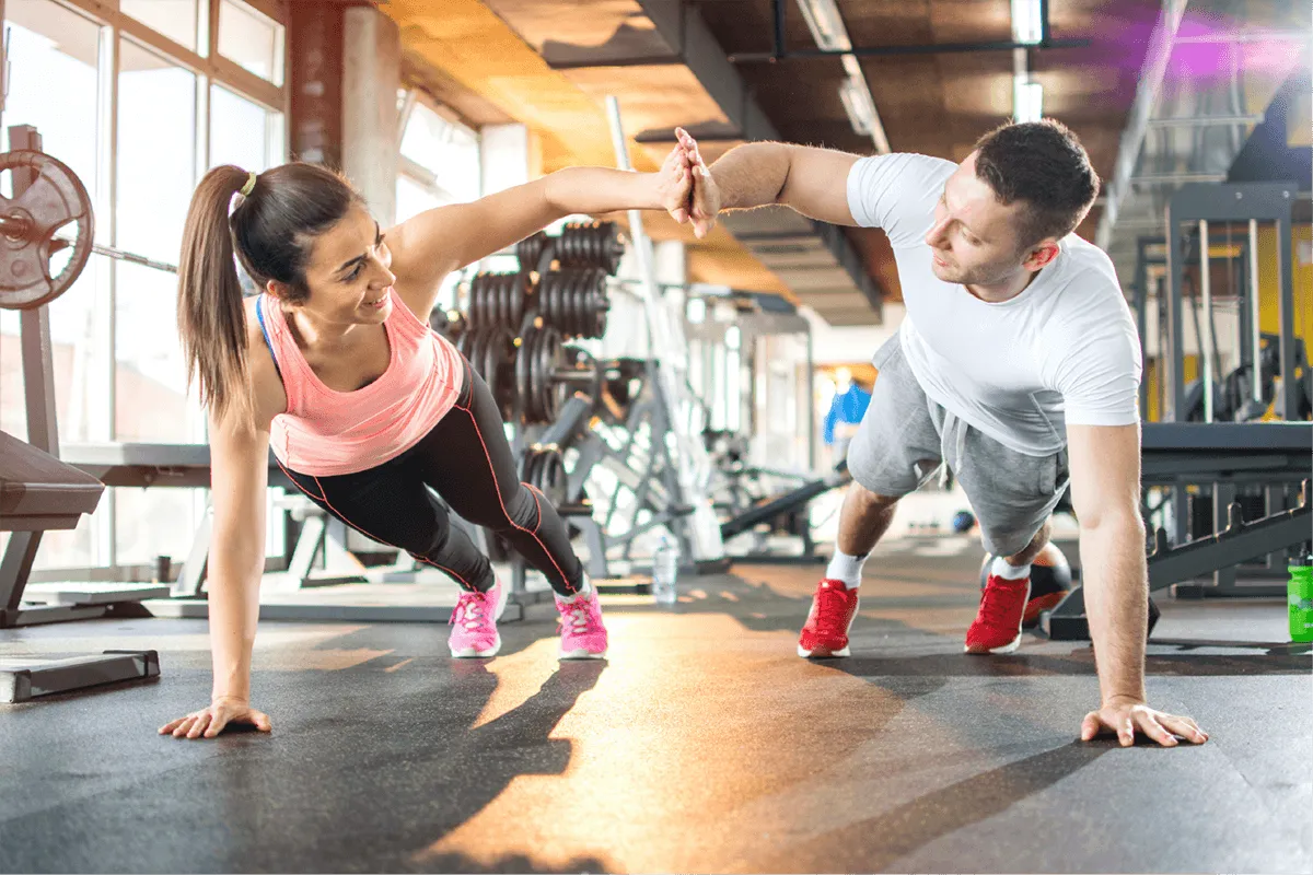 Fitness partners doing a team workout together at the gym